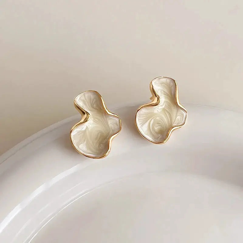 Simples Market pair of white marbled cloud stud earrings with gold-tone edging