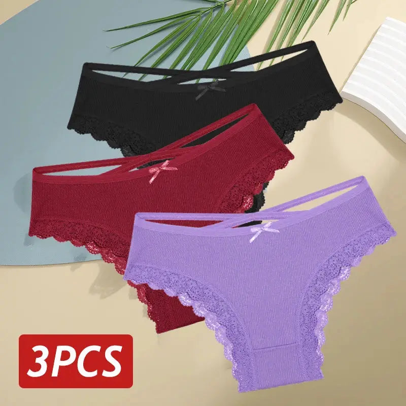 3-piece set of women's lace-trimmed panties in black, red and lavender with bows.
