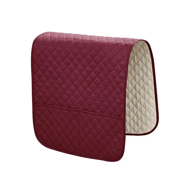 Quilted burgundy sofa armrest cover with pockets, water-repellent slipcover for remote and phone.