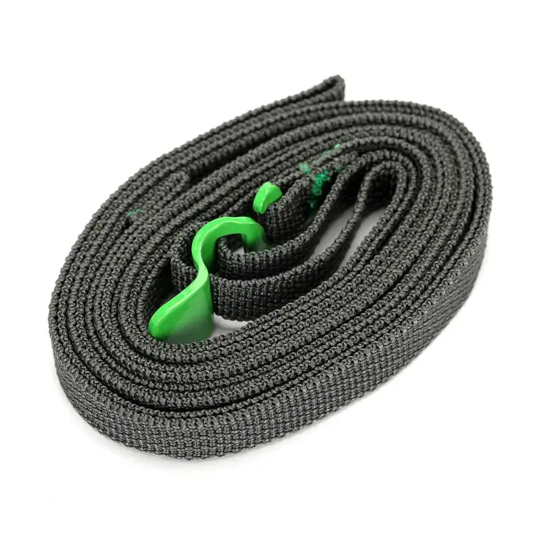 Luggage strap by Simples Market; black nylon with green quick-release buckle.