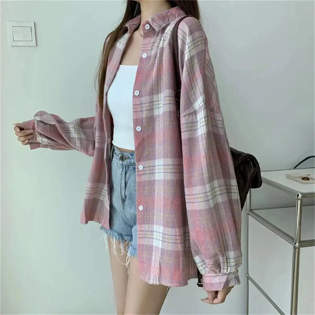 Pink plaid Korean blouse with long sleeves, button-front, loose fit.