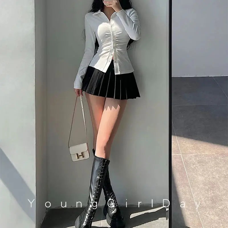 Pleated skirt with shorts, black mini A-line, paired with white blouse and knee-high lace-up boots, Simples Market