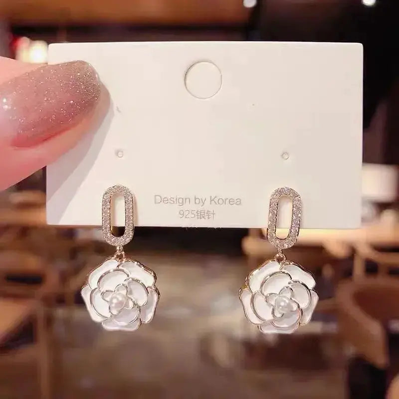 White floral enamel pearl-dangle earrings, pair by Simples Market with silver-tone settings