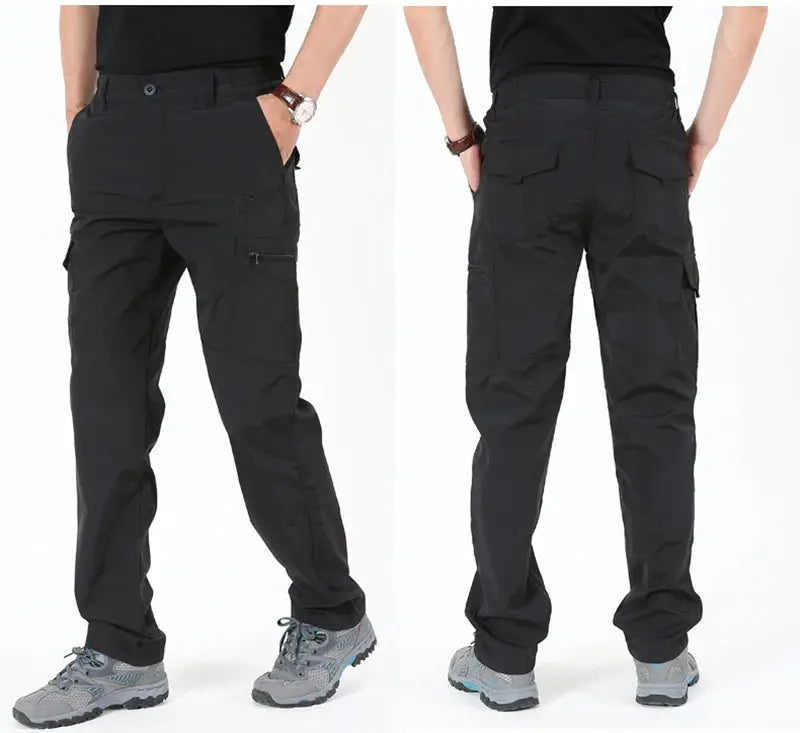 Men's black tactical cargo pants with fleece lining and multiple pockets; waterproof winter workwear.