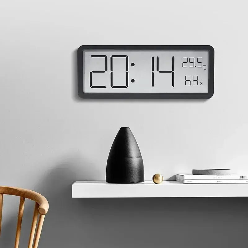 LCD digital wall clock with black frame, large time display, and temperature 29.5°C plus humidity 68%