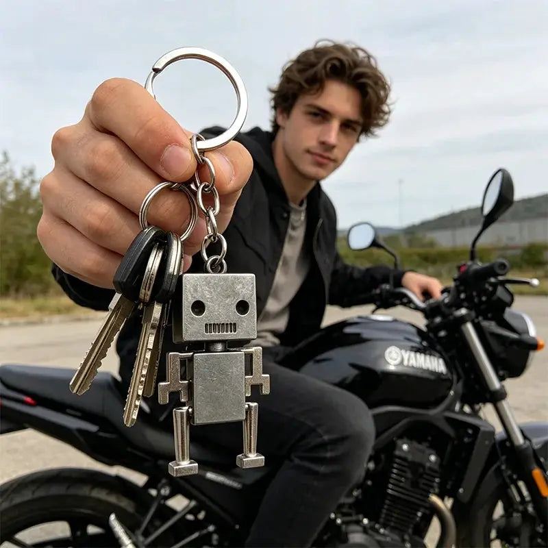 Metal retro movable robot keychain with square head and jointed limbs on a key ring