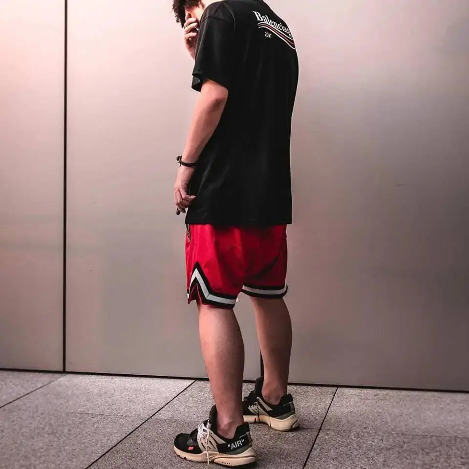 Men's basketball shorts by Simples Market in red with black/white trim; mesh quick-dry gym shorts