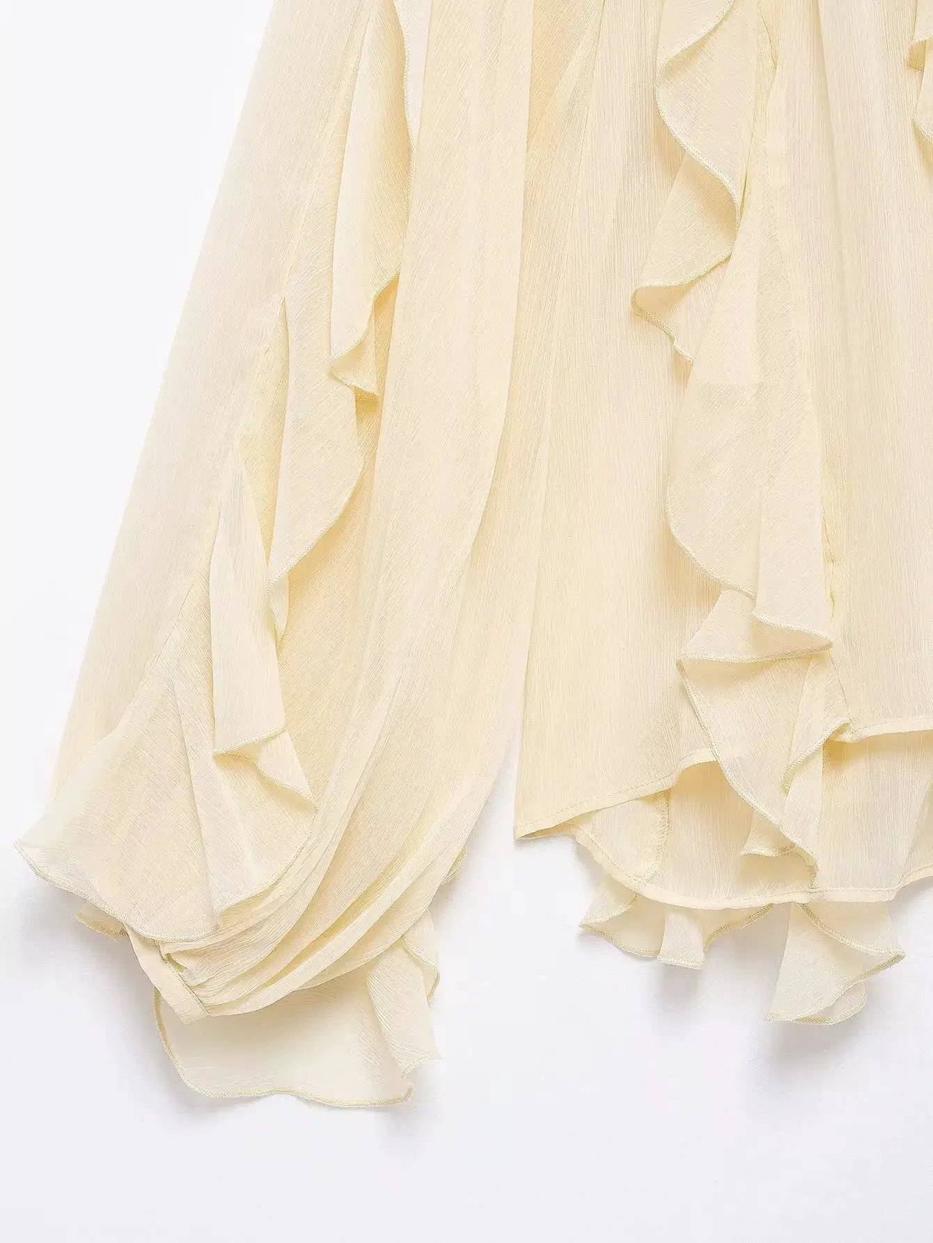 Women's ivory chiffon blouse with cascading ruffles and lightweight sheer fabric