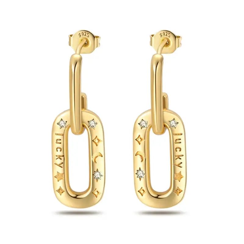 Pair of gold-tone oval drop earrings with engraved LUCKY lettering and crystal accents