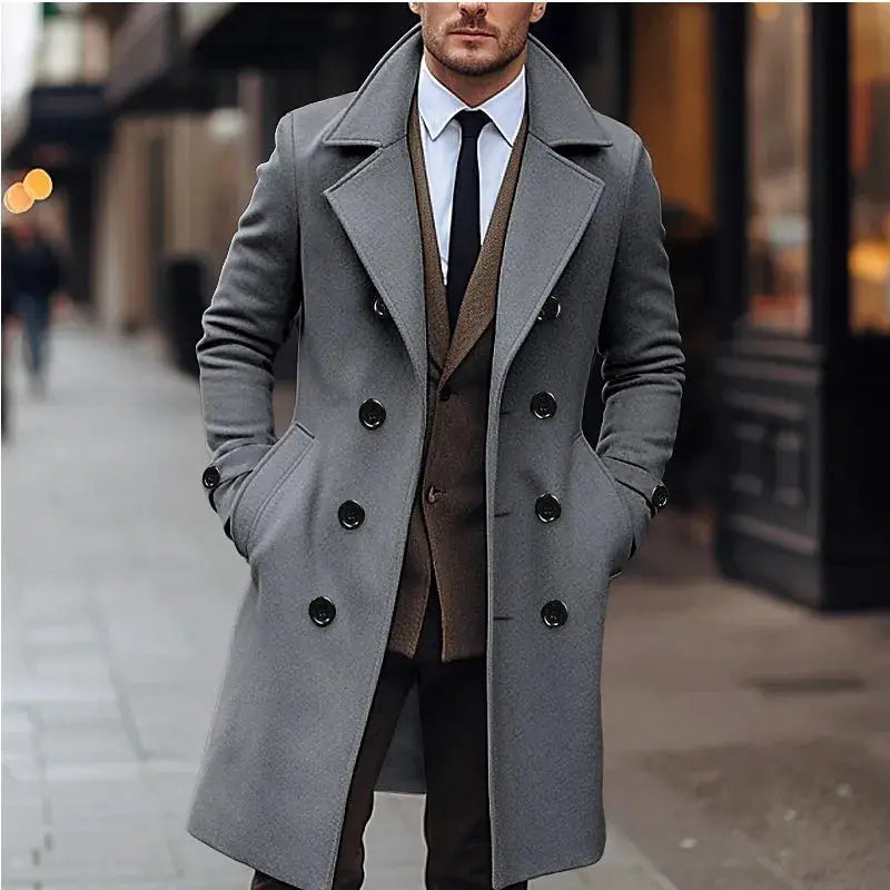 Men's long gray wool double-breasted trench coat with wide lapels.