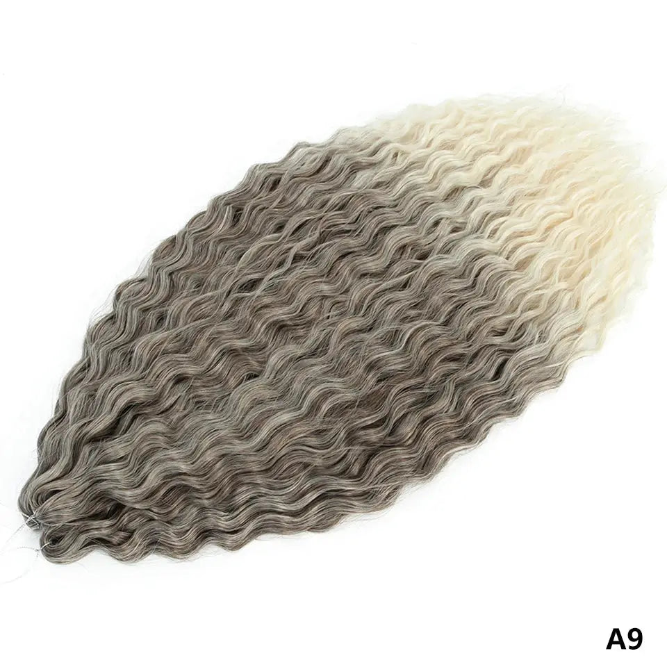 Ariel Curls crochet hair extensions with water-wave deep curls, synthetic ombre from dark gray to blonde.
