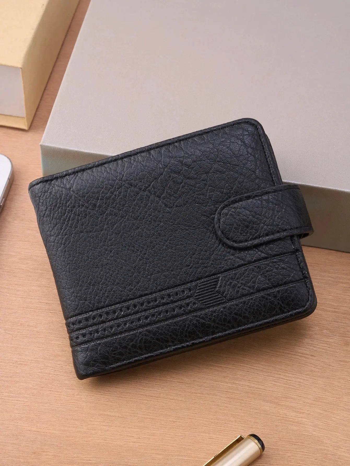 Men's black leather wallet by Simples Market with textured finish, snap strap, and card slots
