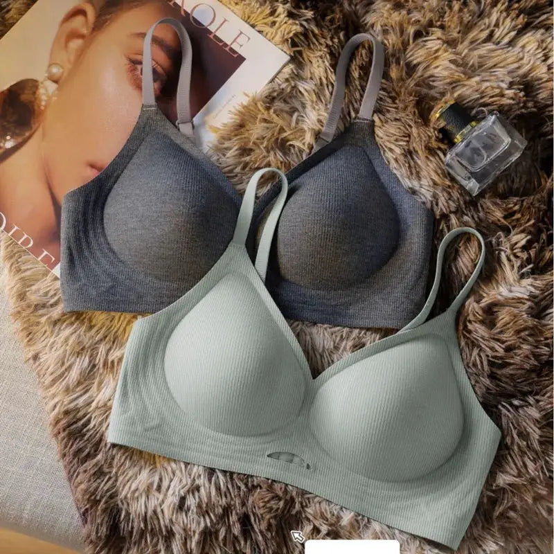 Seamless wire-free bras (2) in gray and sage green for comfortable, breathable wear.