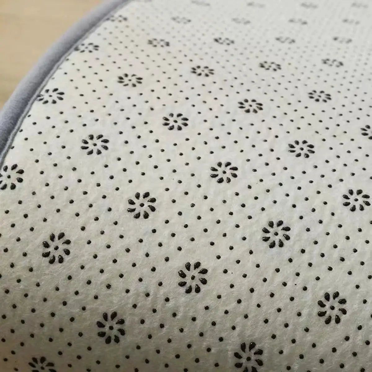 Soft shag rug by Simples Market, cream with black floral dot pattern