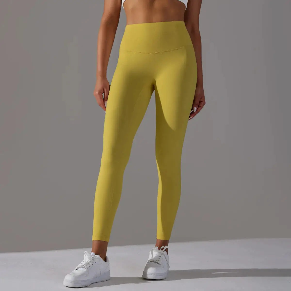 High-waist Naked Feeling leggings for women in mustard yellow, ideal for fitness and yoga