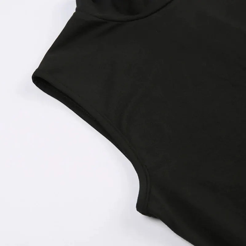 Women's black romper close-up showing curved leg opening