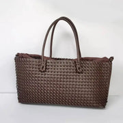 Brown woven tote bag with double handles, large-capacity hand-held shoulder bag.