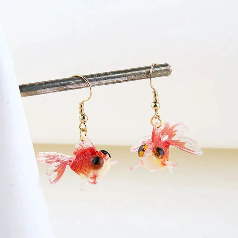 Goldfish pendant earrings, pair of pink transparent koi fish on gold-tone hooks by Simples Market