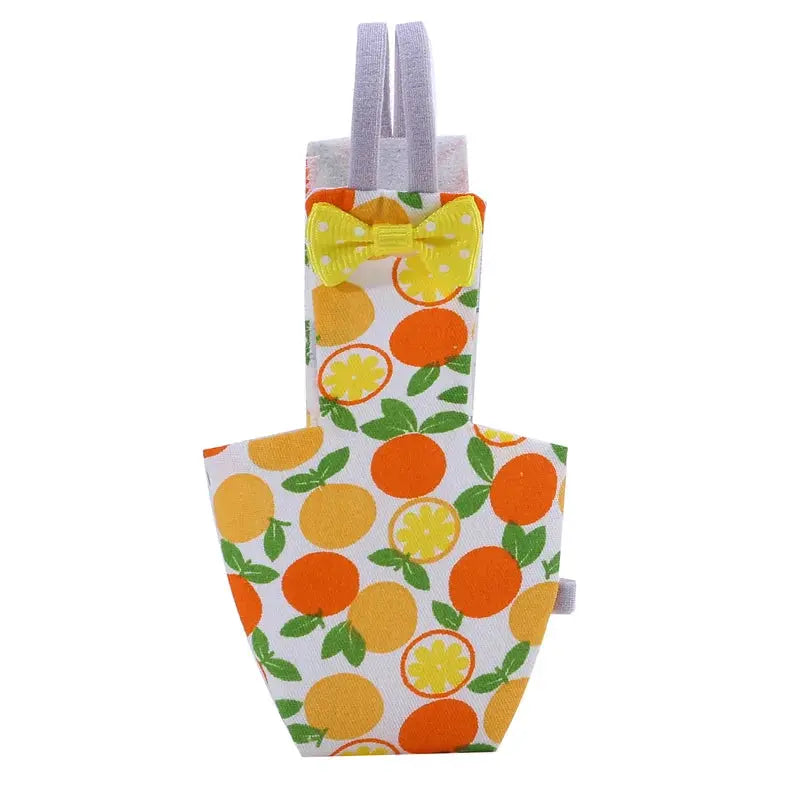 Parrot diaper with bowtie flight suit by Simples Market, orange and yellow citrus print, washable