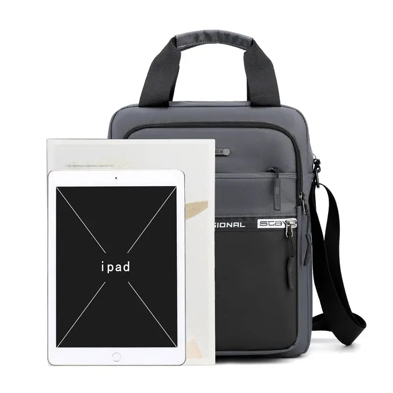 Men's gray crossbody bag with adjustable strap, Simples Market; shown with iPad for scale.