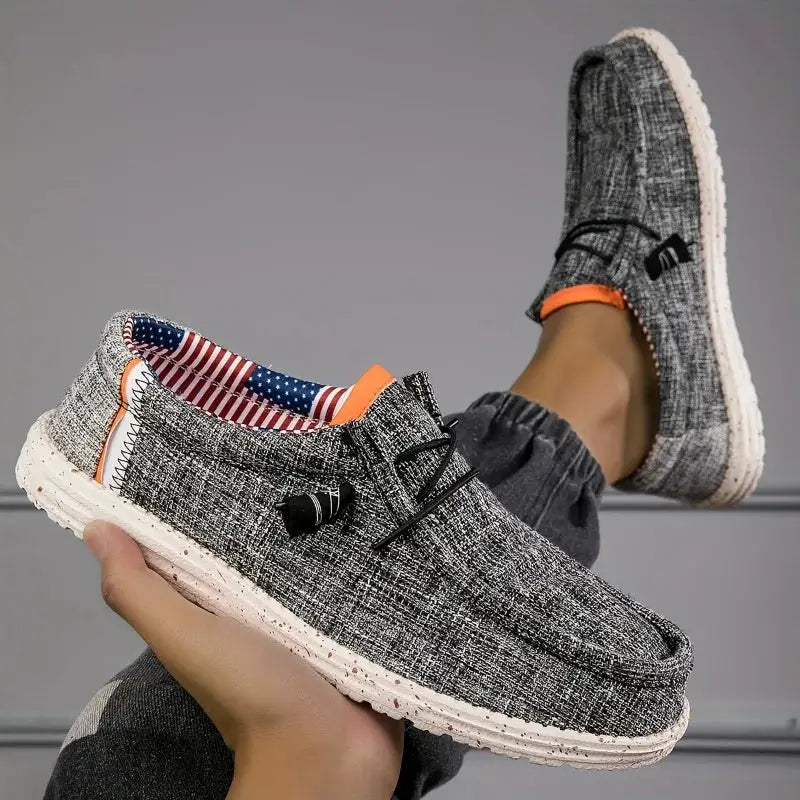Men's gray canvas loafers with white speckled sole