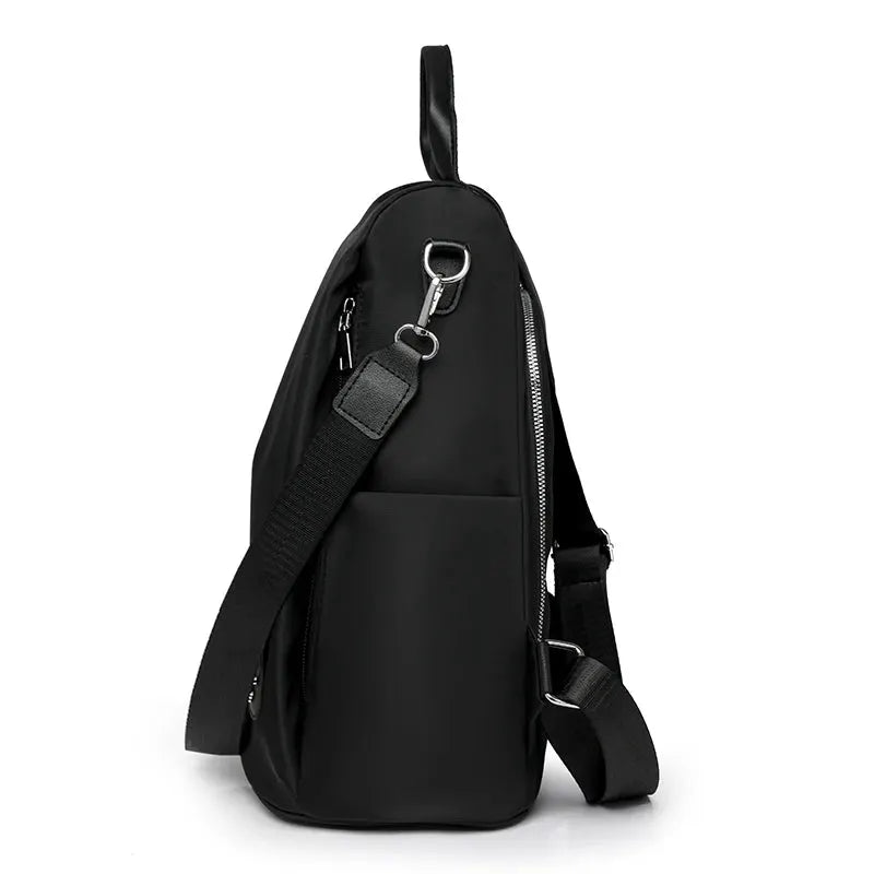 Simples Market women's anti-theft backpack in black with adjustable shoulder strap and large capacity.