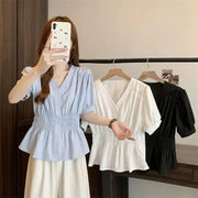 Women's elastic-waist peplum tops in blue, white, and black from Simples Market; short sleeves, V-neck