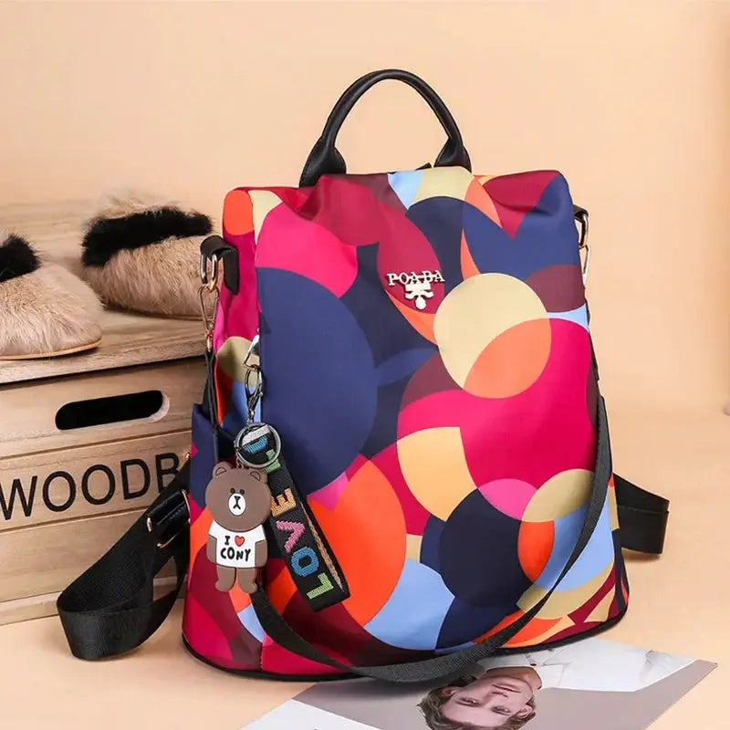 Women backpack with multicolor abstract circle print, Oxford cloth, large capacity travel bag with top handle.