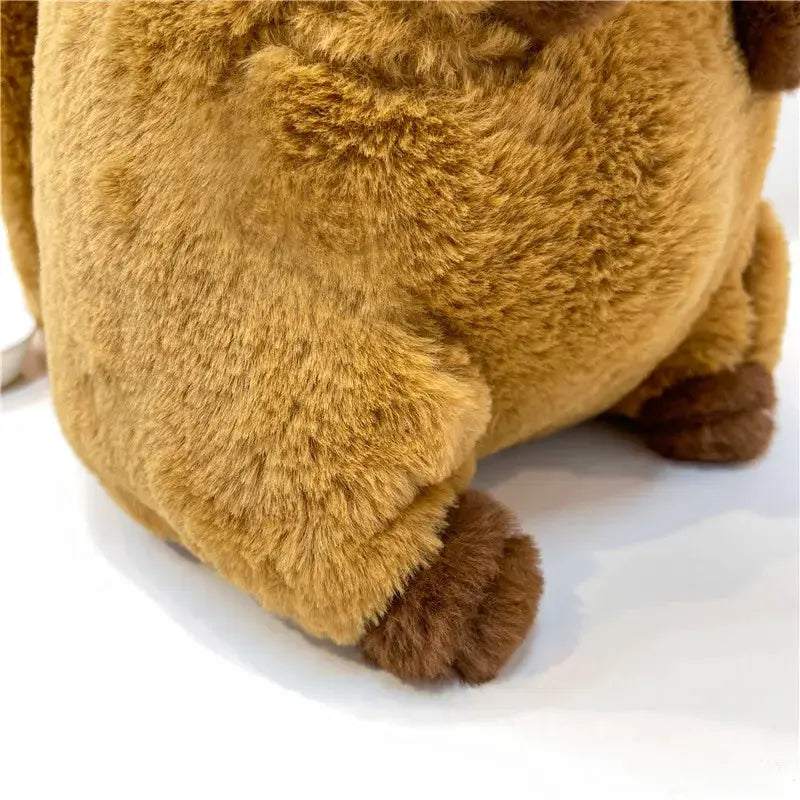 Capybara plush backpack in light brown fur with dark brown paws, a cute crossbody bag.