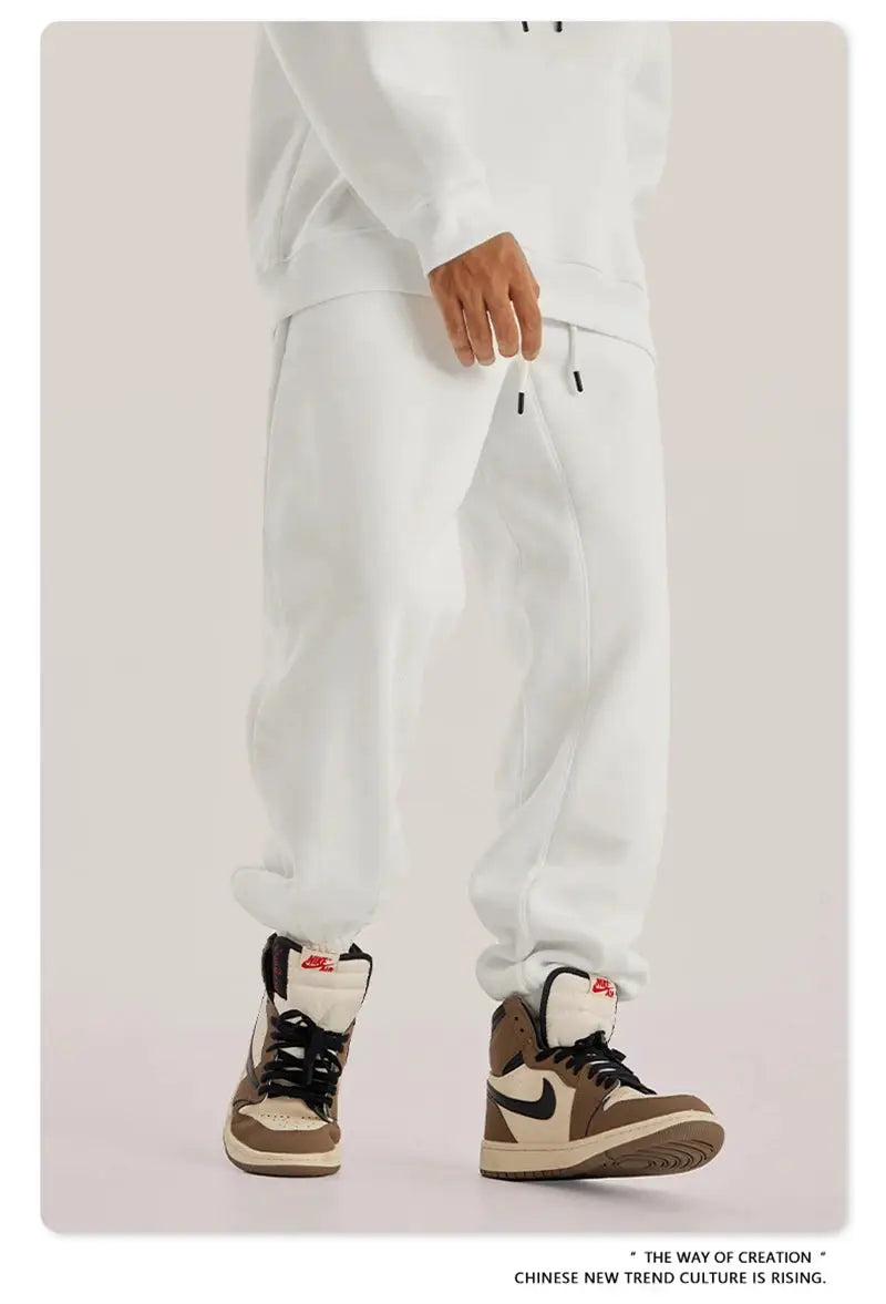 ZODF Trendy Men 345gsm fleece sweatpants, white, unisex loose joggers with drawstrings, paired with Nike sneakers
