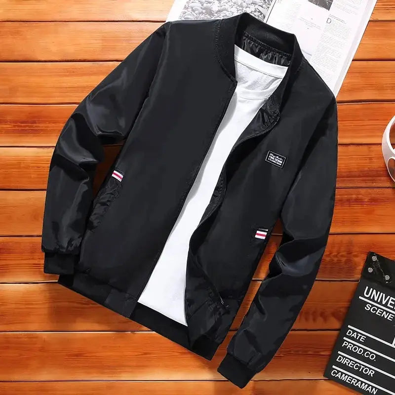 Men's lightweight windbreaker jacket by Simples Market; black, with zip pockets, casual outdoor style.