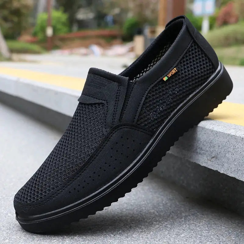 Men's breathable slip-on casual shoes with black mesh upper and rubber sole from Simples Market.