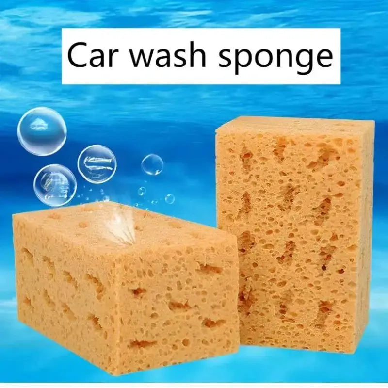 Two large yellow honeycomb car wash sponge blocks against a blue water background