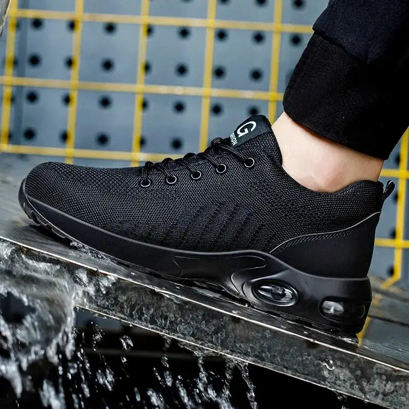 Air Cushion work safety shoe by Simples Market; black steel-toe sneaker with breathable knit upper and lace-up
