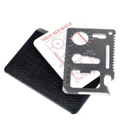 Wallet card knife EDC multitool in stainless steel with ruler cutouts, shown with black wallet