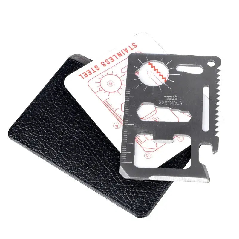 Wallet card knife EDC multitool in stainless steel with ruler cutouts, shown with black wallet