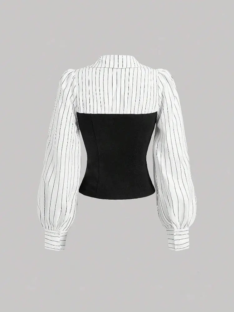 Women's striped blouse with puff sleeves and black waist panel for business casual office wear