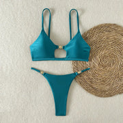 Turquoise high-cut bikini set with push-up triangle top and cheeky bottoms, gold hardware on straps