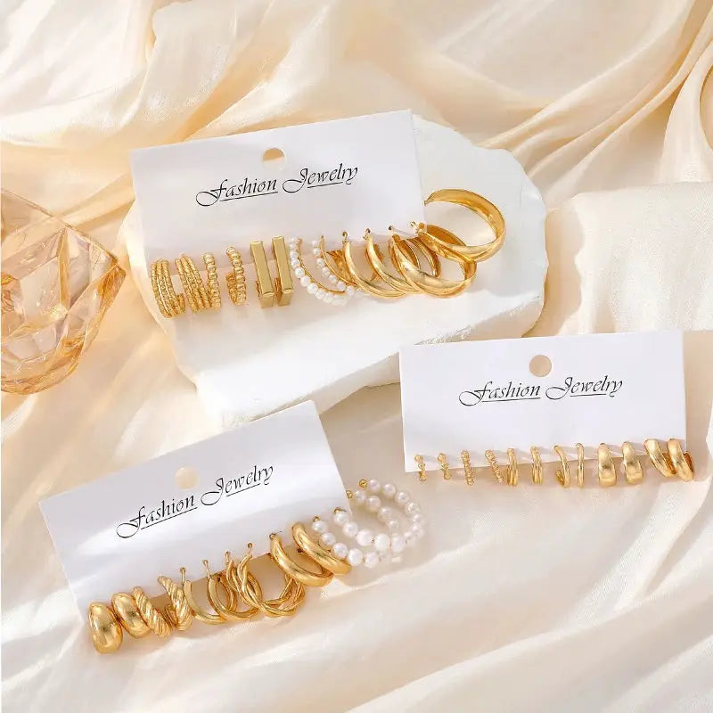 Geometric hoop earrings set for women in gold-tone with pearl accents, multiple styles on display.