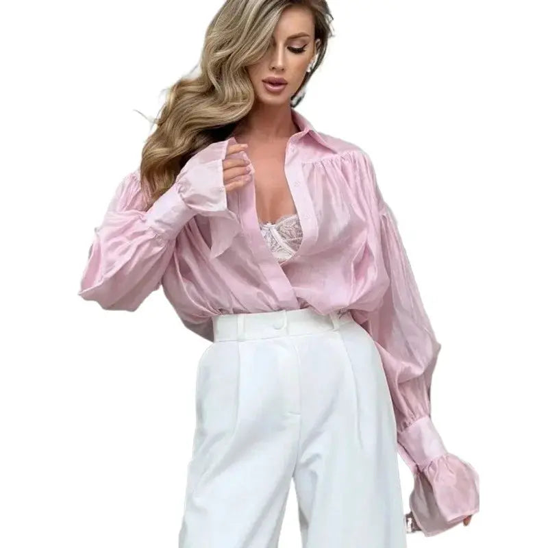 Shirt pink loose collared with flare sleeves, paired with white high-waisted trousers