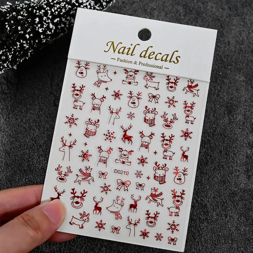 Winter Christmas nail sticker sheet with red reindeer, snowmen, snowflakes and bows; self-adhesive decor