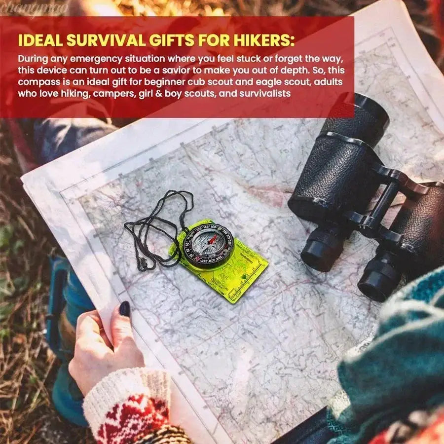 Waterproof compass for hiking and camping, black with a lanyard, on a map with binoculars; Simples Market