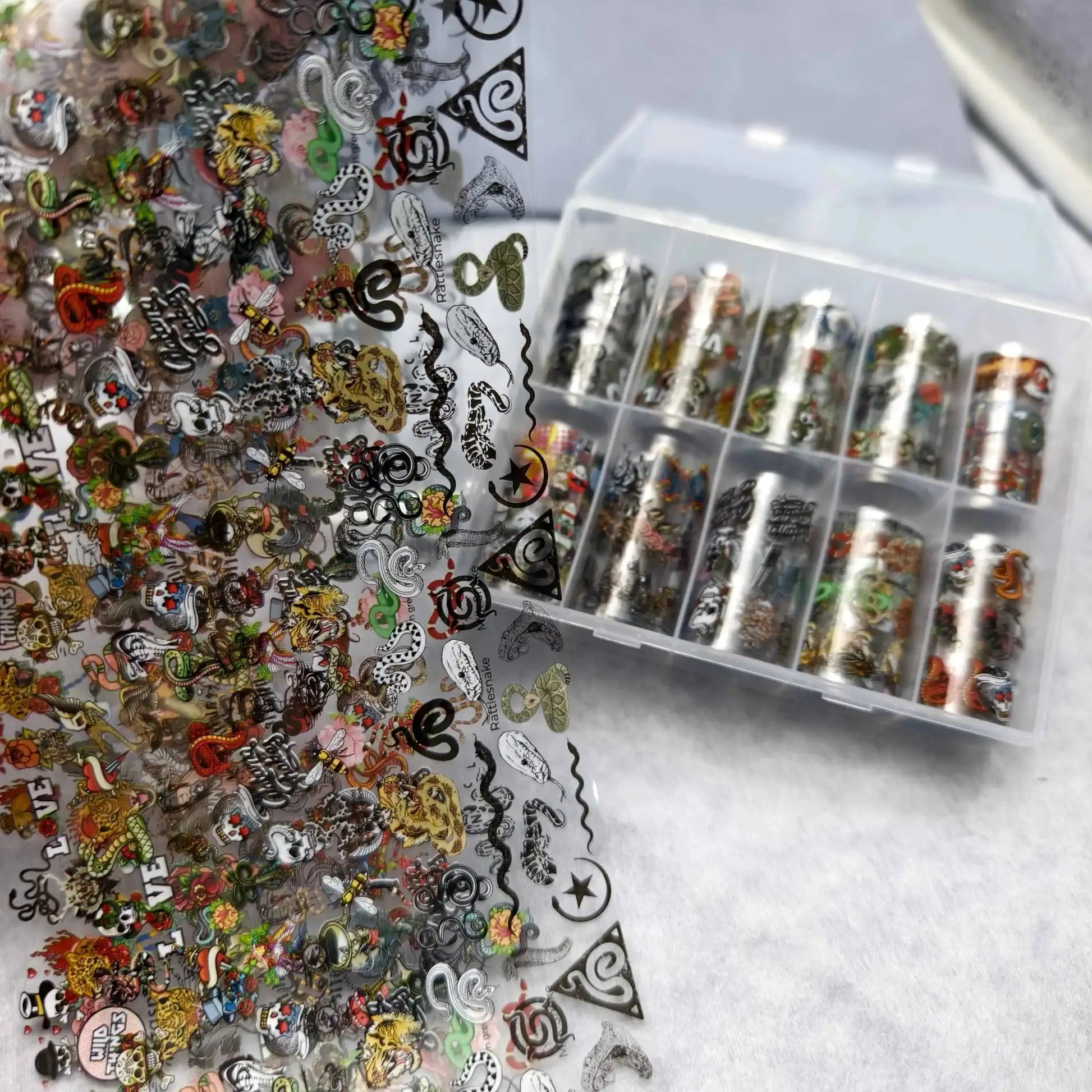 Nail art stickers and foils set with Halloween flower, plaid, angel, and marble designs; 10 rolls by Simples Market