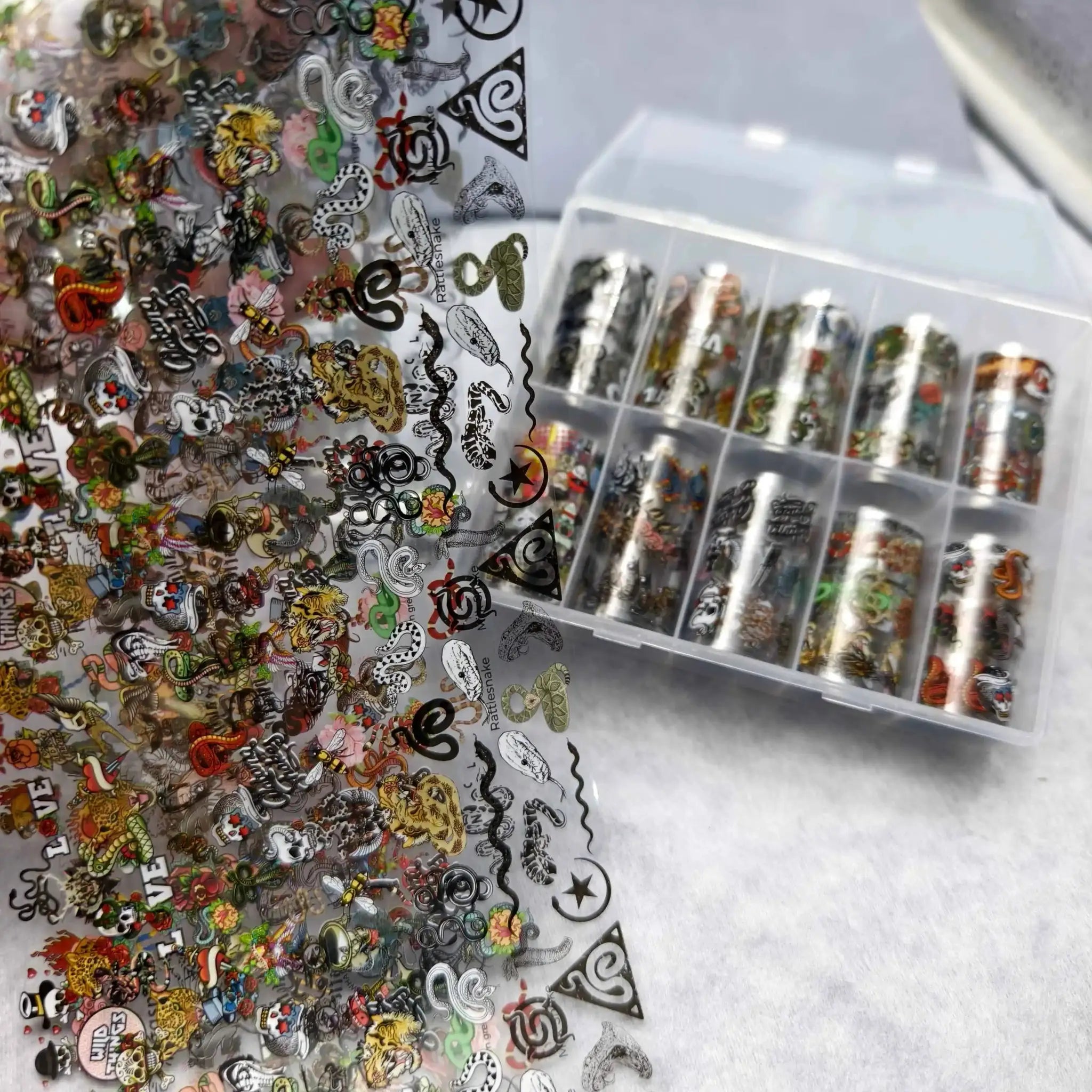 Nail art stickers and foils set with Halloween flower, plaid, angel, and marble designs; 10 rolls by Simples Market