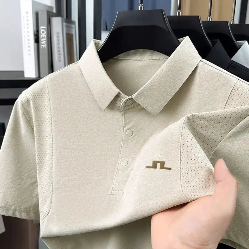 Set of four men's polo shirts on hangers; beige front shirt with perforated side panels and small gold logo by Simples Market