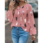 Women's pink feather-print chiffon blouse with long sleeves, from Simples Market worn with blue jeans.