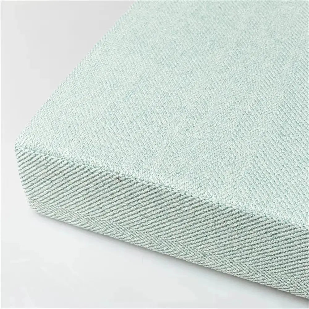Square chair seat cushion by Simples Market in light mint green fabric with a machine-washable cover.
