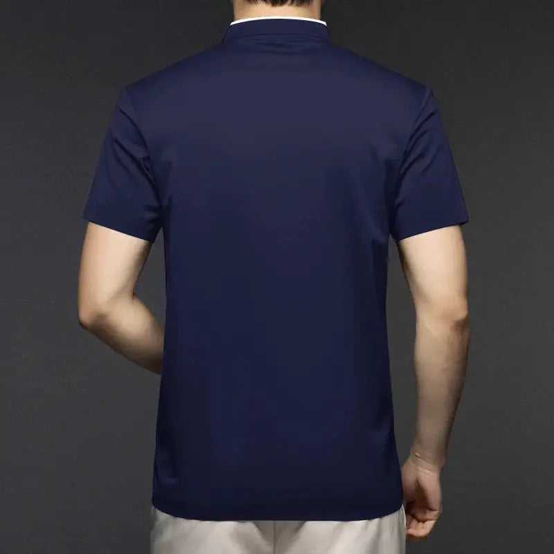 Men's navy blue polo shirt with short sleeves and stand-up collar; back view.