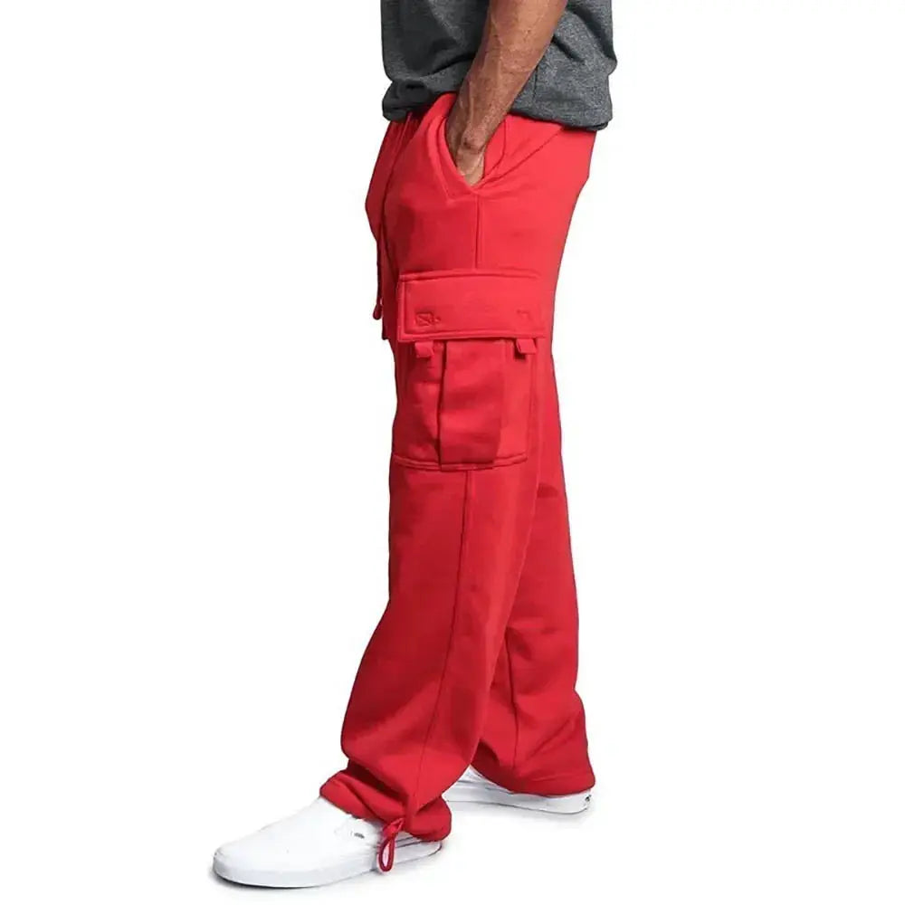 Men's red cargo sweatpants with large thigh pockets, loose sport-fit joggers and ankle drawstrings