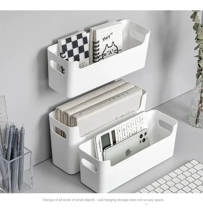Three white plastic wall-mounted kitchen organizer baskets by Simples Market